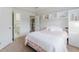 Bright bedroom features a big window, bedside cabinet, and ensuite access at 200 Long Needle Ct, Sugar Hill, GA 30518