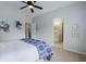 Bedroom featuring carpeted floors, vaulted ceilings, and an open doorway to the attached bathroom at 200 Long Needle Ct, Sugar Hill, GA 30518