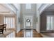 Spacious two-story foyer with hardwood floors, offering views of adjacent living spaces at 200 Long Needle Ct, Sugar Hill, GA 30518