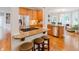 Stylish kitchen featuring granite countertops, stainless steel appliances, and a breakfast bar with seating at 200 Long Needle Ct, Sugar Hill, GA 30518