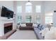 Spacious living room with high ceilings, fireplace, and ample seating, ideal for Gathering gatherings at 200 Long Needle Ct, Sugar Hill, GA 30518