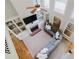 Open-concept living room with large windows, built-in shelving, and fireplace at 200 Long Needle Ct, Sugar Hill, GA 30518