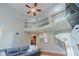 Elegant living room with grand staircase, soaring ceiling, and natural light, blending comfort with sophistication at 200 Long Needle Ct, Sugar Hill, GA 30518