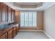 Bright office space featuring custom cabinetry and modern shutters for optimal natural light control at 200 Long Needle Ct, Sugar Hill, GA 30518