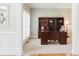 Office featuring a traditional desk and hutch, shuttered window, carpeted floors, and classic design elements at 200 Long Needle Ct, Sugar Hill, GA 30518