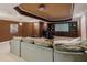 Home theater with comfortable seating, built-in shelving, projector, and a large screen at 200 Long Needle Ct, Sugar Hill, GA 30518