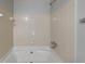 A clean, functional bathroom features a tiled shower-tub combination and chrome fixtures at 3637 Chinaberry Ln, Snellville, GA 30039