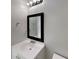 Neutral bathroom with a framed mirror, classic white vanity, and chrome fixtures at 3637 Chinaberry Ln, Snellville, GA 30039