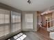 Bright living room featuring large windows, light gray walls, and light vinyl plank flooring at 3637 Chinaberry Ln, Snellville, GA 30039