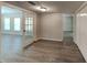 Home office area with double glass doors, luxury vinyl floors and an abundance of light at 3637 Chinaberry Ln, Snellville, GA 30039