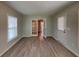 Bright living area features updated floors, a glass-paned door, and a classic white entry door at 3637 Chinaberry Ln, Snellville, GA 30039