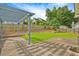 Outdoor patio area with lawn and wood fence at 375 Shadetree Ln, Lawrenceville, GA 30044
