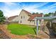 Beautiful backyard features lush grass, partial home views, and a shaded pergola at 375 Shadetree Ln, Lawrenceville, GA 30044