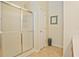 Bright bathroom featuring a glass shower door and neutral wall paint at 375 Shadetree Ln, Lawrenceville, GA 30044