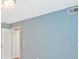 Inviting bedroom featuring pale blue walls, white doors, and neutral carpeting for a warm and inviting space at 375 Shadetree Ln, Lawrenceville, GA 30044