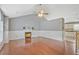 Open-concept living room with fireplace and hardwood flooring at 375 Shadetree Ln, Lawrenceville, GA 30044