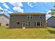 Well maintained backyard with green grass and large two-story home at 3876 Thackary Dr, Powder Springs, GA 30127