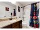 Bathroom with granite counters, decorated with Marvel superhero themed decor at 3876 Thackary Dr, Powder Springs, GA 30127