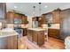 Bright kitchen with stainless steel appliances, granite countertops, and a convenient center island at 3876 Thackary Dr, Powder Springs, GA 30127