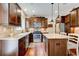 Well-lit kitchen featuring stainless steel appliances, granite countertops, and a functional kitchen island at 3876 Thackary Dr, Powder Springs, GA 30127