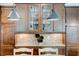 Close-up of kitchen featuring dark cabinets with glass inserts and stainless steel accents at 3876 Thackary Dr, Powder Springs, GA 30127