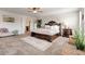 Bright and airy main bedroom featuring a decorative rug, king bed, and ceiling fan at 3876 Thackary Dr, Powder Springs, GA 30127