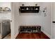 Cozy mudroom with a shoe rack, hanging storage, and easy access to the laundry room at 3876 Thackary Dr, Powder Springs, GA 30127