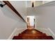 View of a hardwood staircase with white walls and trim leading to the lower floor at 3876 Thackary Dr, Powder Springs, GA 30127