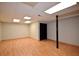 Unfinished basement with laminate flooring and ample open space at 5040 Puritan Dr, Sugar Hill, GA 30518