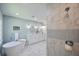 Bright bathroom boasts a soaking tub, double vanity, and a tiled walk-in shower at 5040 Puritan Dr, Sugar Hill, GA 30518