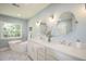 Bright bathroom featuring a soaking tub, double vanity, and modern fixtures at 5040 Puritan Dr, Sugar Hill, GA 30518