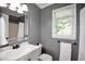 Bathroom featuring a marble vanity, neutral walls, and a shower/tub combo at 5040 Puritan Dr, Sugar Hill, GA 30518