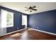Bedroom showcasing a ceiling fan, hardwood floors, and lots of natural light at 5040 Puritan Dr, Sugar Hill, GA 30518