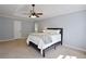 Bedroom with king bed, ceiling fan, and neutral carpeting at 5040 Puritan Dr, Sugar Hill, GA 30518