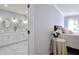 Bedroom leading into a Primary bath with double sinks and mirrors at 5040 Puritan Dr, Sugar Hill, GA 30518