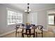 Bright dining area with large window and stylish chandelier at 5040 Puritan Dr, Sugar Hill, GA 30518