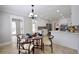 Bright eat-in kitchen with stylish decor, white cabinets, and stainless appliances at 5040 Puritan Dr, Sugar Hill, GA 30518