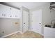 Practical laundry room with cabinets and utility sink at 5040 Puritan Dr, Sugar Hill, GA 30518