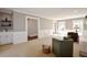 Bright living room with a fireplace, dry bar, and french doors that provide access to an outdoor area at 5040 Puritan Dr, Sugar Hill, GA 30518