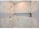 Updated tiled shower with niche and modern shower head fixture at 5040 Puritan Dr, Sugar Hill, GA 30518