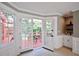 Sunroom featuring french doors leading to a patio at 5040 Puritan Dr, Sugar Hill, GA 30518