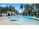 Community pool featuring covered cabanas, splash fountains and ample lounge seating for residents at 566 Silver Moon Dr, Loganville, GA 30052