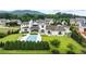 Expansive aerial view of home with pool, manicured lawns, and mountain backdrop at 1640 Kenai Rd, Kennesaw, GA 30152