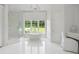 Bright bathroom featuring a soaking tub, large window, and separate glass shower at 1640 Kenai Rd, Kennesaw, GA 30152