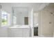 Elegant bathroom with a large mirror, white marble countertops, and access to the shower at 1640 Kenai Rd, Kennesaw, GA 30152