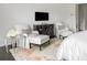 Bedroom sitting area featuring plush seating, modern furnishings, and large windows at 1640 Kenai Rd, Kennesaw, GA 30152