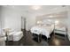 Bright bedroom with hardwood floors, decorative lighting, and large windows at 1640 Kenai Rd, Kennesaw, GA 30152