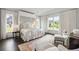 Luxurious bedroom with a canopy bed, large windows, and elegant decor at 1640 Kenai Rd, Kennesaw, GA 30152