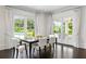Elegant dining room with natural light and outdoor views to pool at 1640 Kenai Rd, Kennesaw, GA 30152