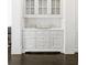 Elegant dining area with custom white built-ins and marble countertops at 1640 Kenai Rd, Kennesaw, GA 30152